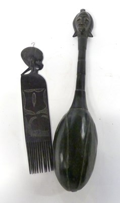 Lot 407 - A large East African wooden spoon with carved...
