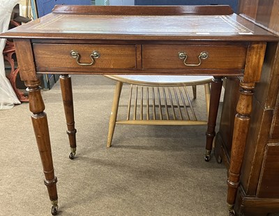 Lot 409 - A Victorian mahogany two drawer writing table...