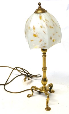 Lot 410 - A brass table lamp with three footed base and...