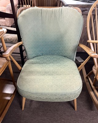 Lot 415 - An Ercol light elm armchair with stick back...