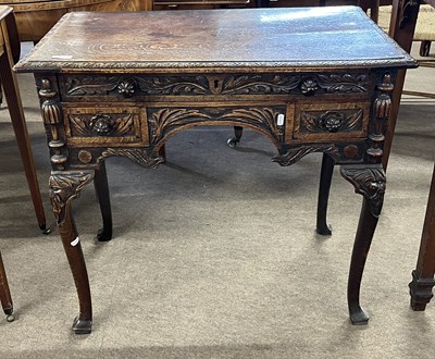 Lot 432 - A Georgian oak low boy with one long and two...