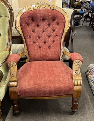 Lot 435 - A Victorian walnut framed button back armchair...