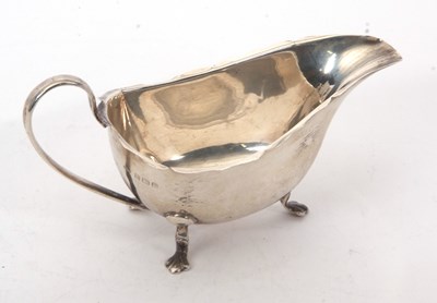 Lot 54 - A George VI silver sauce boat of typical form...