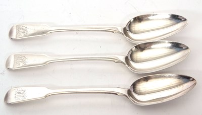 Lot 76 - Three George III silver fiddle pattern serving...