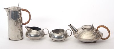 Lot 141 - An Archibald Knox for Liberty & Co four piece...