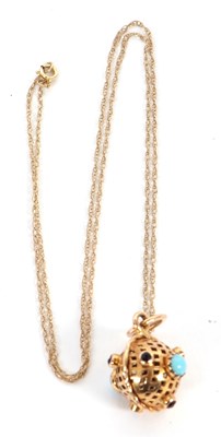 Lot 129 - A gemset pendant necklace, the pierced ball...