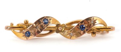 Lot 111 - A 9ct sapphire and diamond brooch, the ribbon...