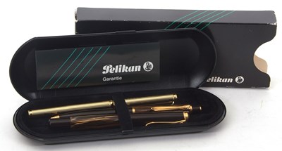 Lot 158 - A cased Pelikan mottled fountain pen and...