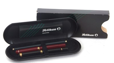 Lot 160 - Three Pelikan fountain pens, one 18k nibbed...