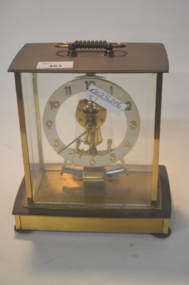 Lot 463 - A brass four glass mantel clock