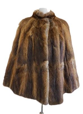 Lot 86 - A Norwich Fur Co. brown fur cape, with side...