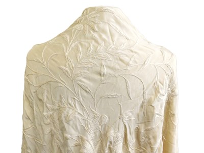 Lot 148 - An early 20th cream silk shawl, with floral...
