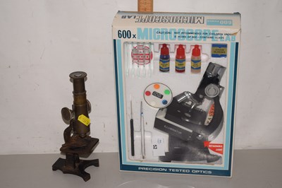 Lot 52 - A small brass monocular microscope, apparently...