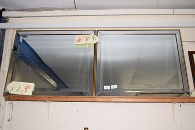 Lot 230 - A pair of bevelled wall mirrors
