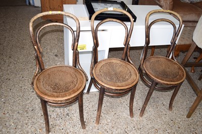 Lot 285 - A set of three bent wood cafe chairs