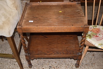Lot 287 - An oak tea trolley on barley twist legs