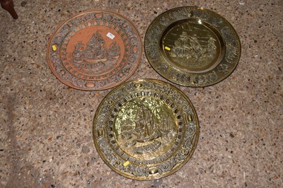 Lot 334 - Three brass wall chargers