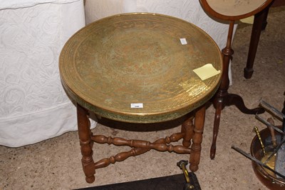 Lot 346 - A brass topped folding table