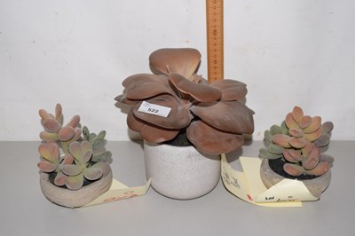 Lot 522 - Three simulated pot plants