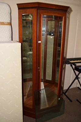 Lot 722 - A cherry wood finish corner display cabinet