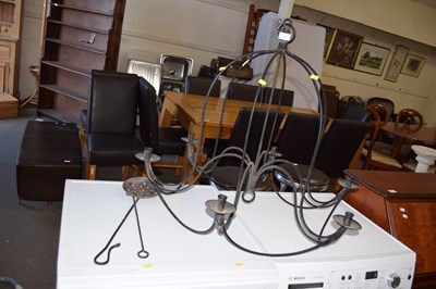 Lot 772 - A large hanging iron candelabra and two fire...