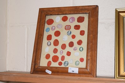 Lot 34 - A framed group of various wax and plaster seals