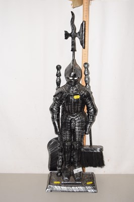 Lot 42 - A fire companion set formed as a Knight in armour