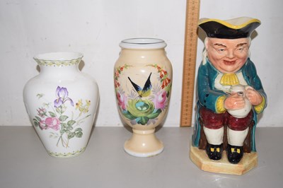 Lot 79 - A Toby jug and two vases