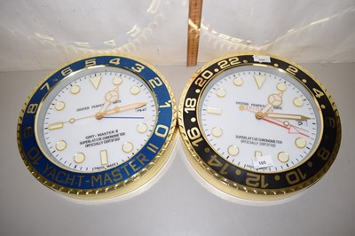Lot 105 - Two Rolex style wall clocks