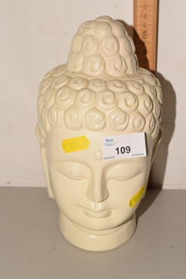 Lot 109 - A porcelain Buddha head model