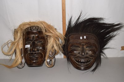 Lot 172 - Two carved wooden masks