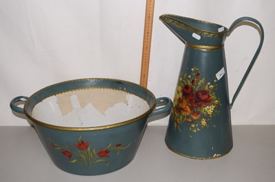 Lot 248 - A metal wash bowl and jug