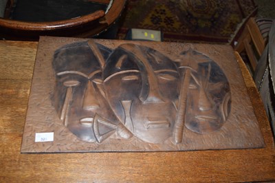 Lot 325 - A pressed sheet metal plaque decorated with...
