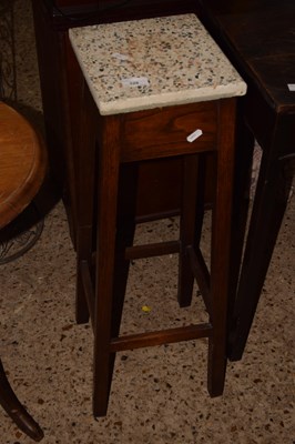 Lot 328 - A tile top plant stand