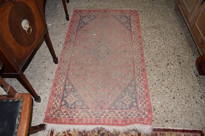 Lot 339 - A small Middle Eastern red ground floor rug,...