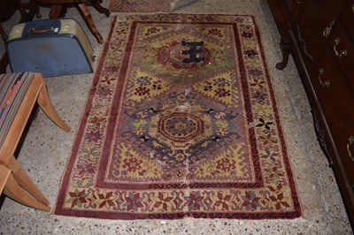 Lot 335 - A small Middle Eastern floor rug with floral...