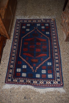Lot 356 - A small Middle Eastern blue ground floor rug
