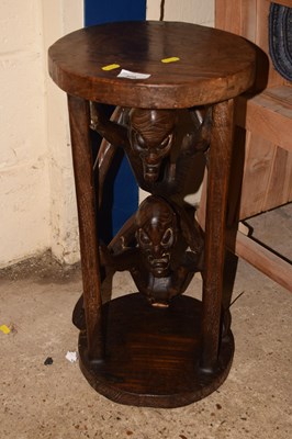 Lot 400 - A carved African hardwood occasional table