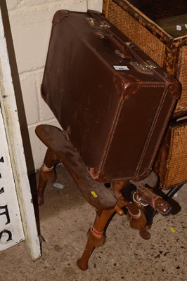 Lot 409 - A vintage camel stool and a suitcase (2)