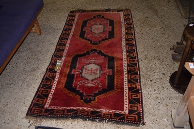 Lot 404 - 20th Century Turkish wool floor rug decorated...