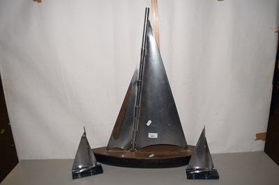 Lot 501 - Metal model yacht with wooden base and two...