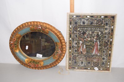 Lot 525 - An oval wall mirror and papyrus painting