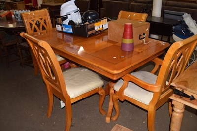 Lot 779 - Modern light wood dining table and four chairs