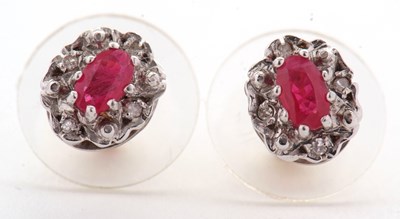 Lot 91 - A pair of ruby and diamond cluster earrings,...