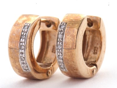 Lot 128 - A pair of diamond set earhoops, the 5mm wide...