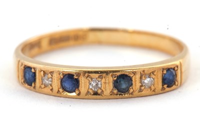 Lot 9 - A 18ct sapphire and diamond ring, with...