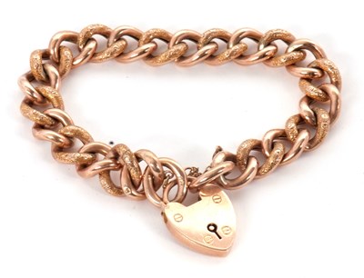 Lot 161 - A 9ct rose gold curblink bracelet, with...
