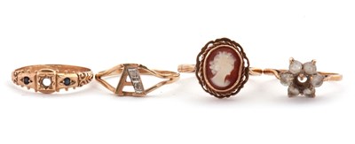 Lot 159 - Four 9ct rings: to include a 9ct cameo ring,...