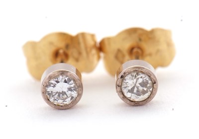 Lot 93 - A pair of unmarked diamond earstuds, each...