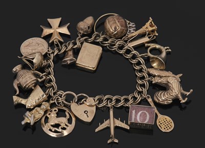 Lot 305 - A 9ct charm bracelet, the double curblink...